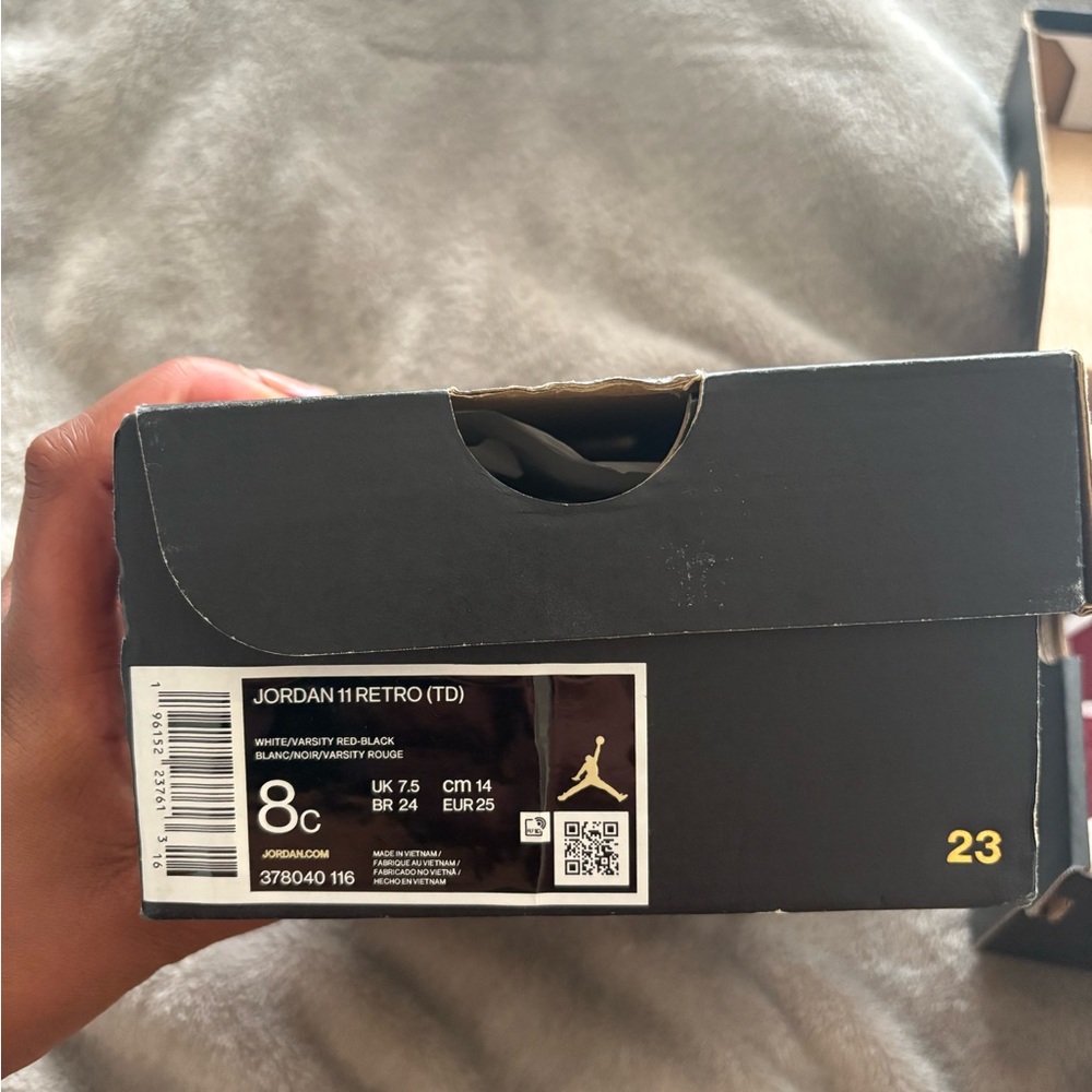 Jordan 11 Retro TD in White, Red, and Black